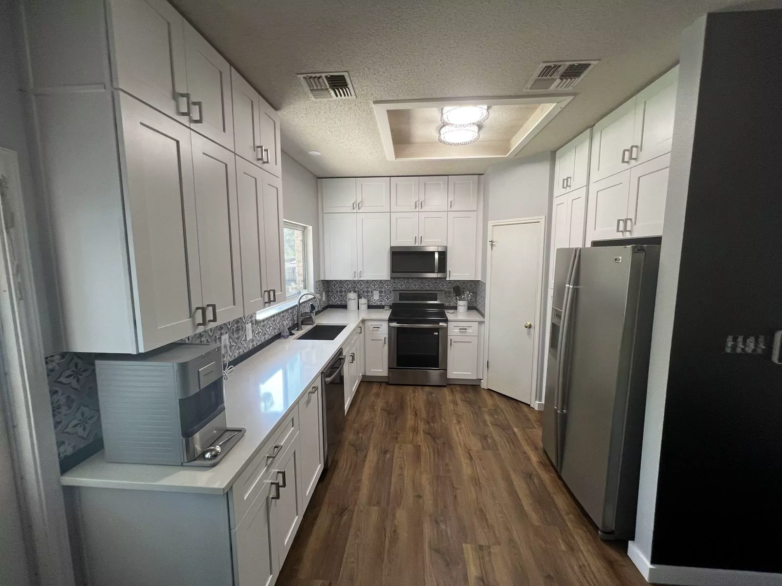 Gray shaker kitchen by The Flip Fixer