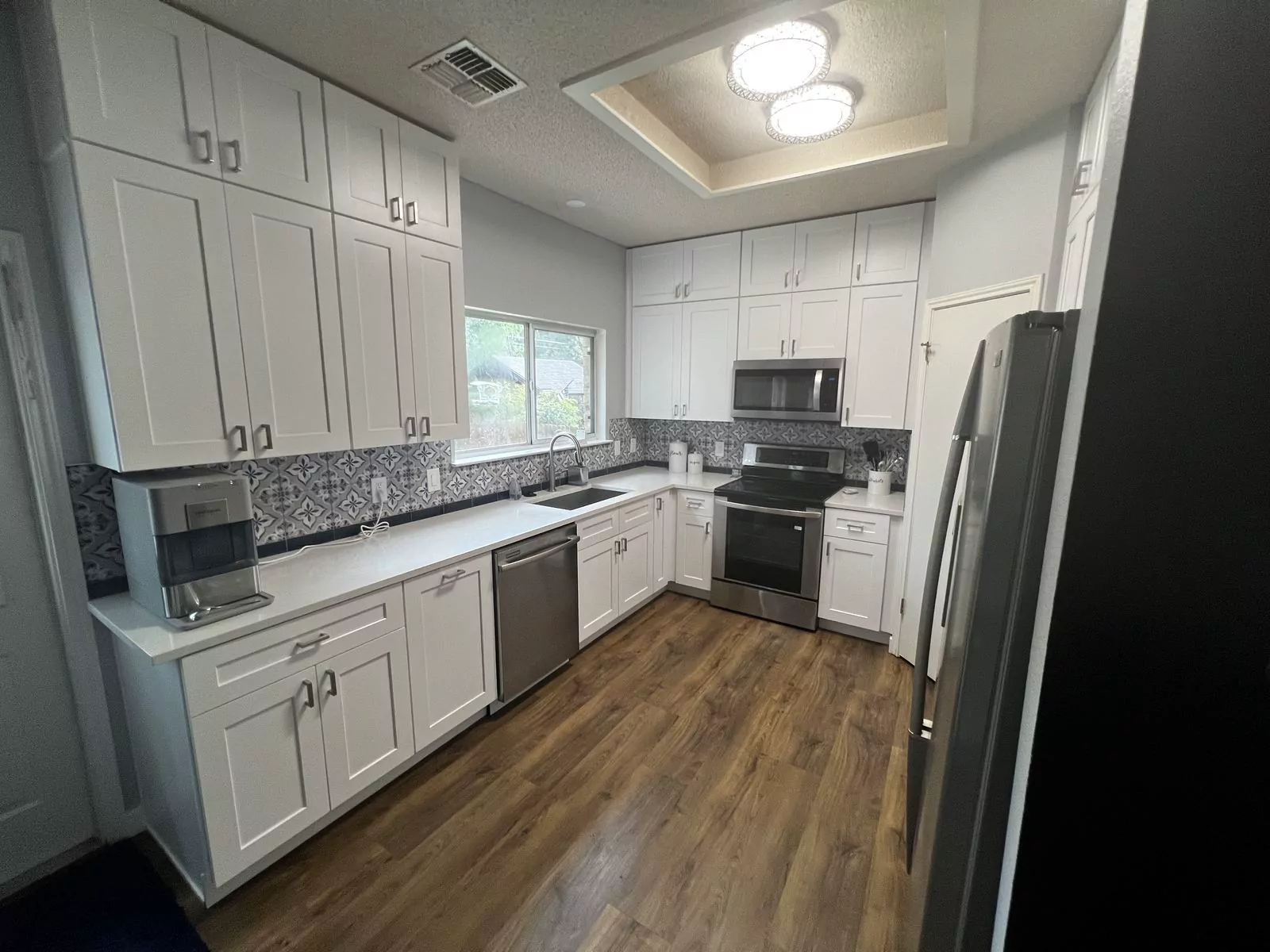 Gray shaker kitchen by The Flip Fixer