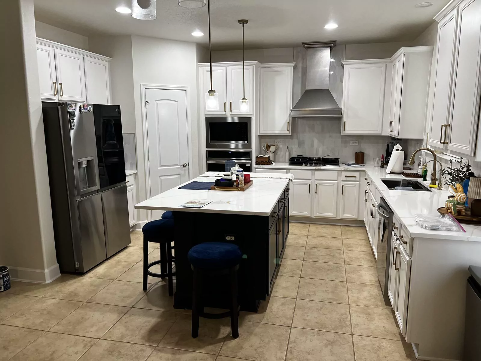 White kitchen, black island by The Flip Fixer