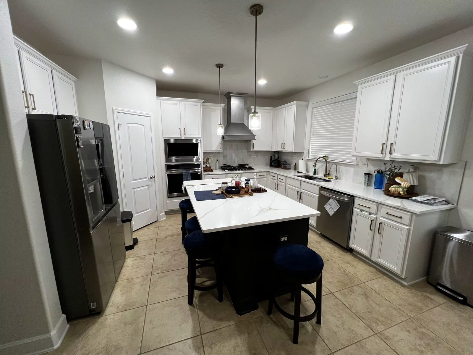 White kitchen, black island by The Flip Fixer