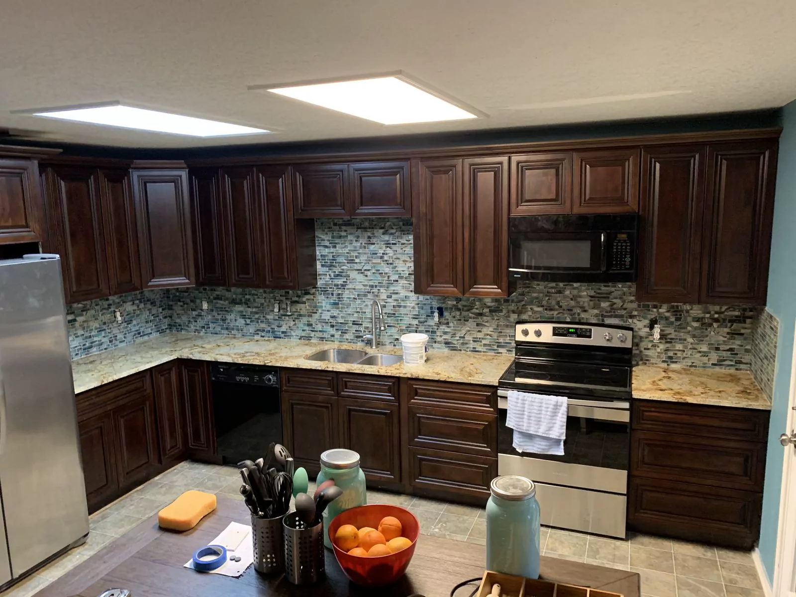 Dark wood kitchen by The Flip Fixer