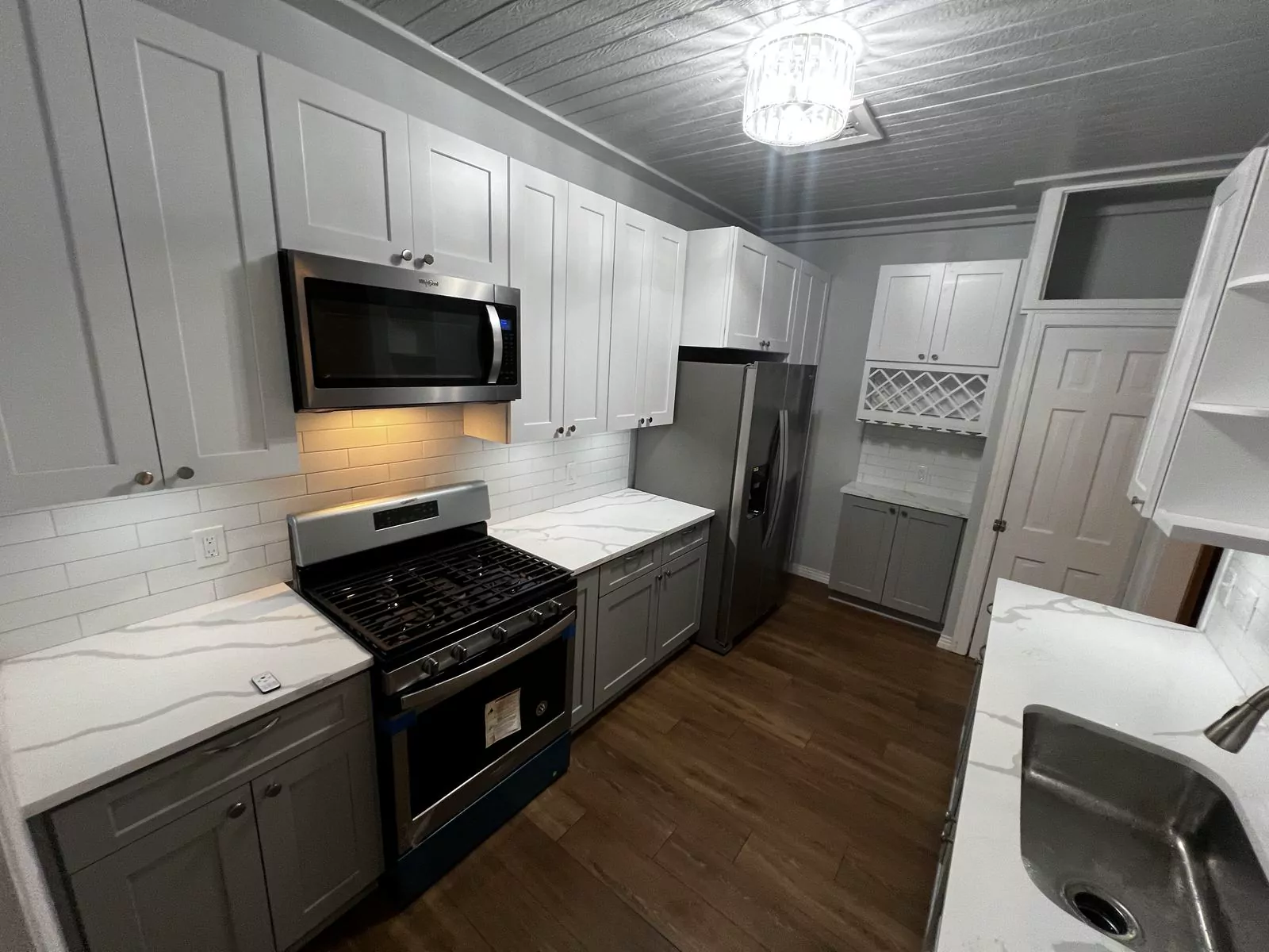 Gray and white kitchen by The Flip Fixer