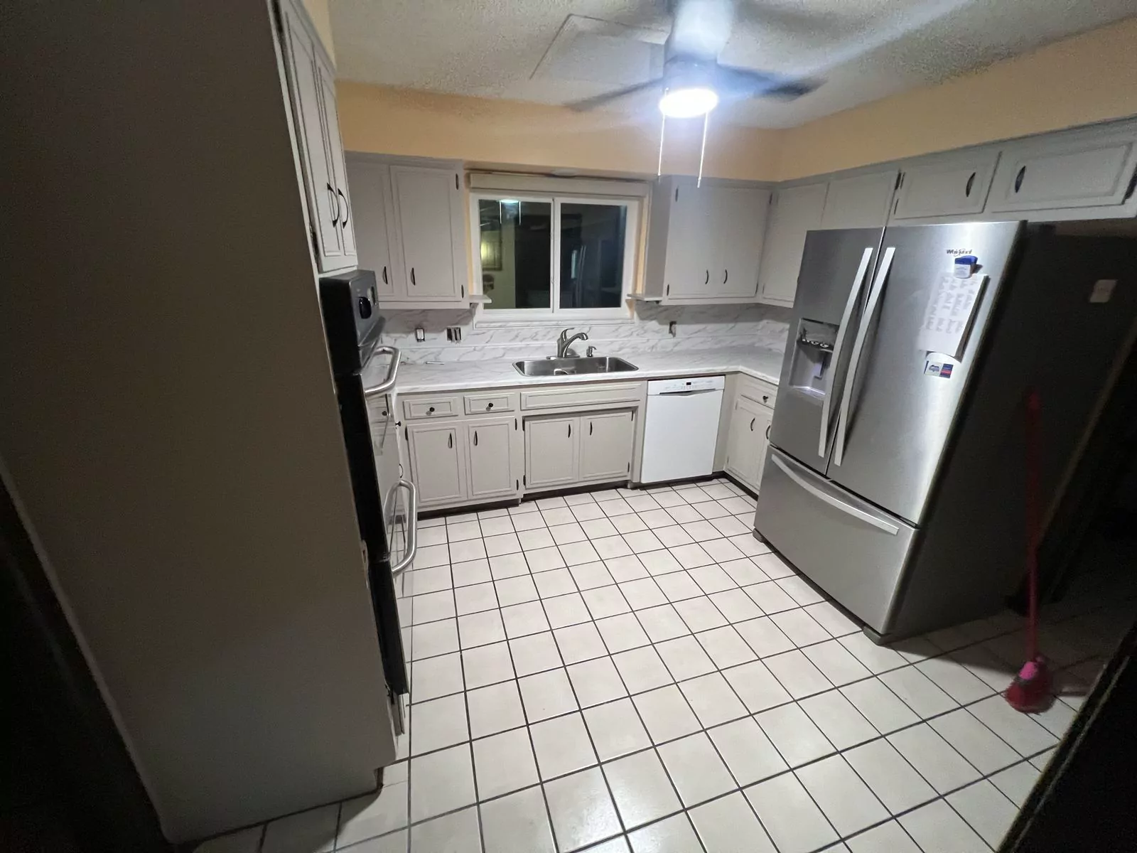 Cream quartz kitchen by The Flip Fixer