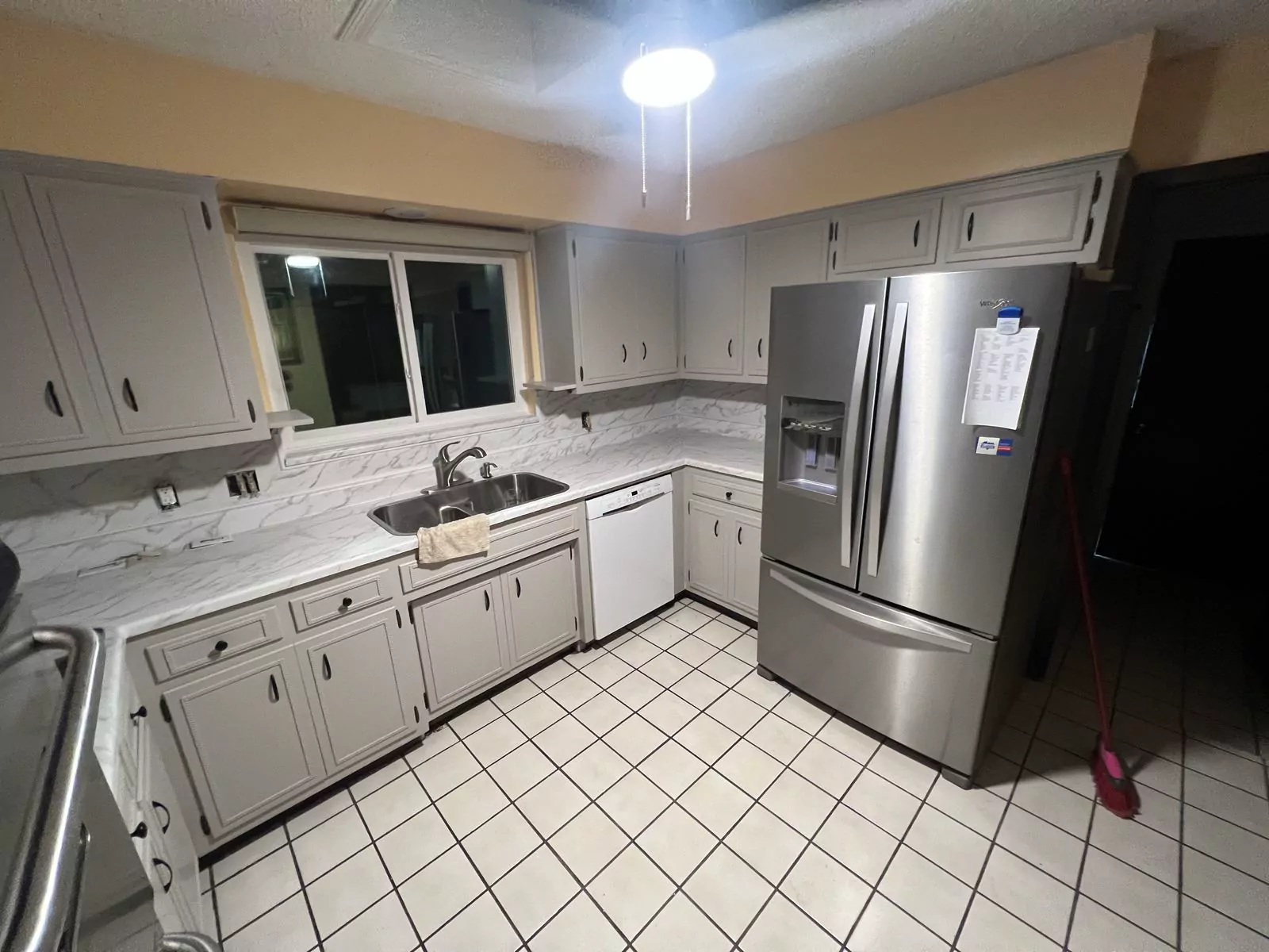 Cream quartz kitchen by The Flip Fixer
