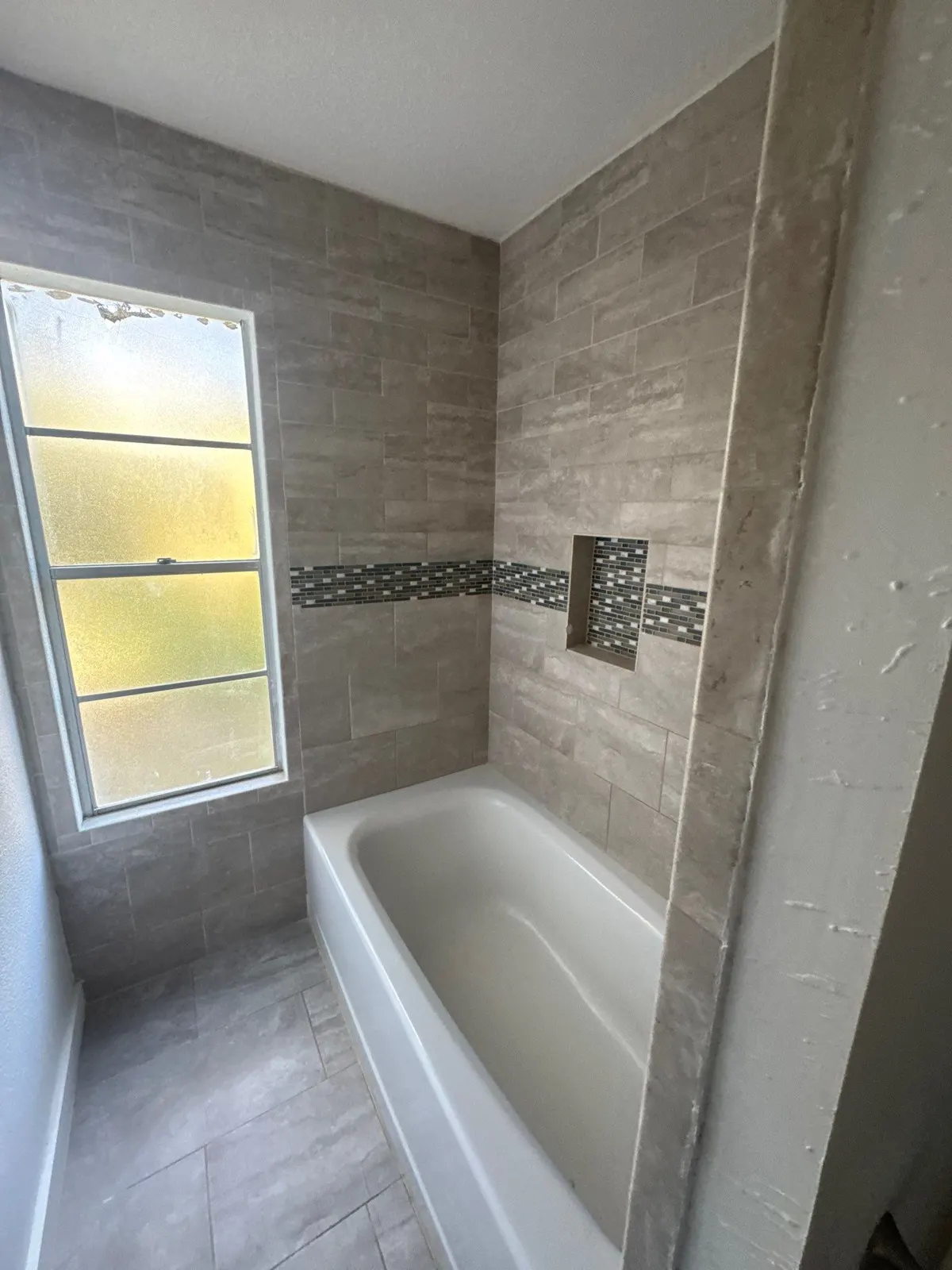 Finished bath after fire rebuild by The Flip Fixer