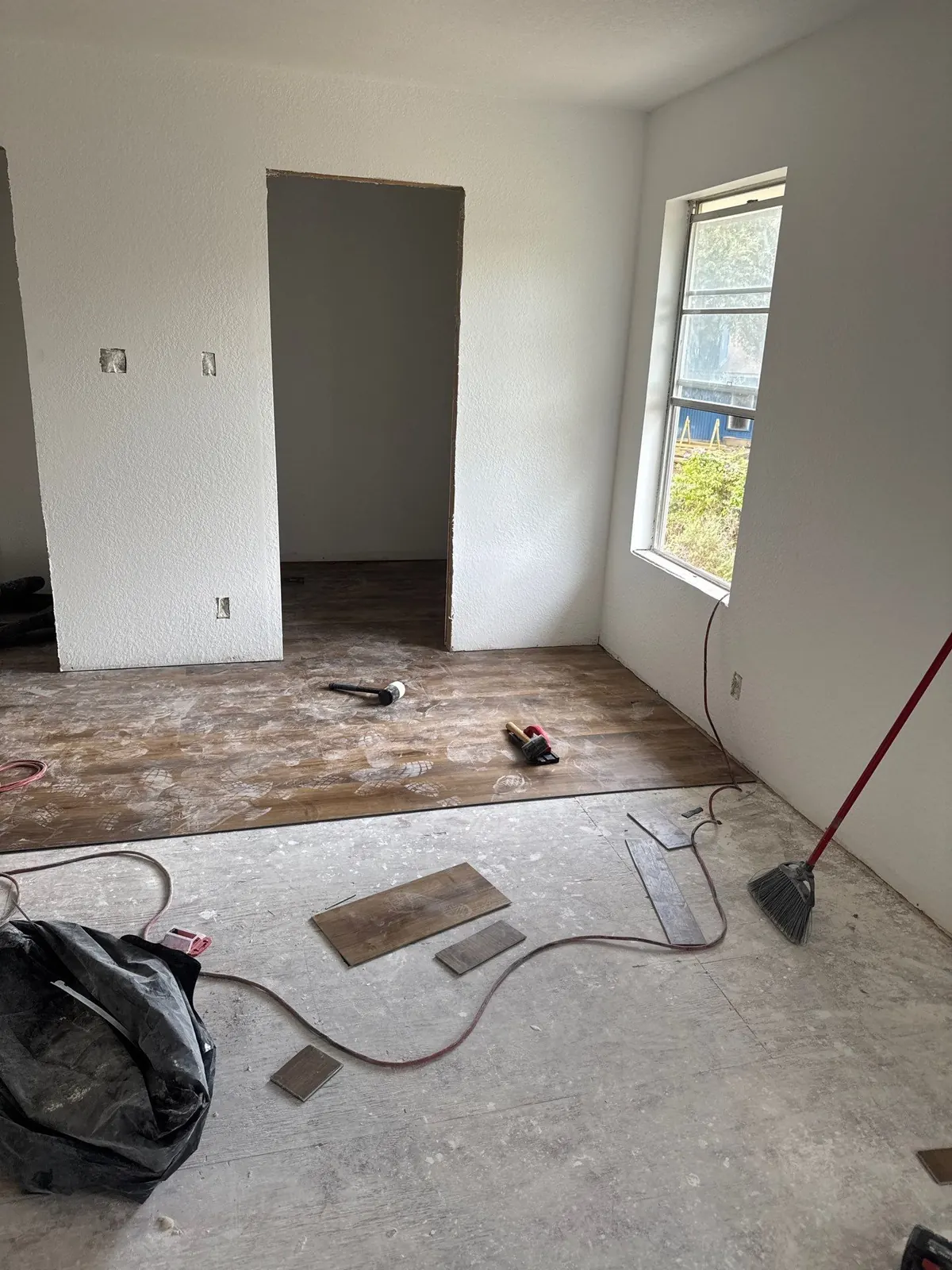 Flooring install during fire rebuild by The Flip Fixer